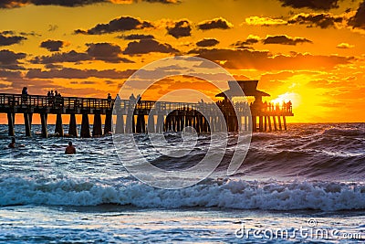 Sunset over the fishing pier and Gulf of Mexico in Naples, Florida. Stock Photo