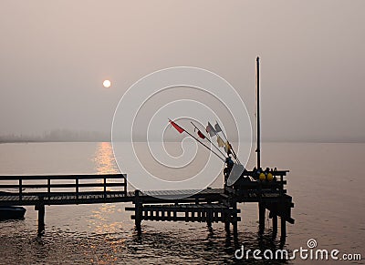 Sunset over a fishing pier in a small village Rewa on the Polish Baltic coastline. Stock Photo