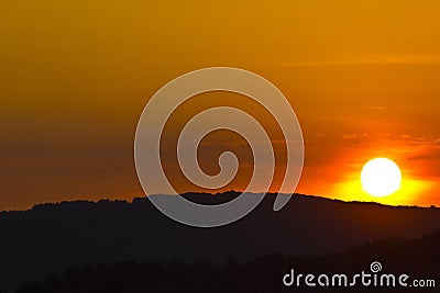 Sunset over hills Stock Photo