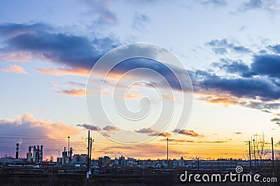 Sunset over industrial city orange light factory Stock Photo