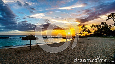 Sunset over the lagoon and beach under blue sky on the West Coast of Oahu Stock Photo
