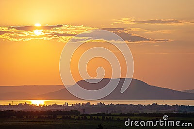 Sunset over lake Balaton and Badacsony Mountain Stock Photo