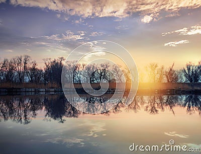 Dynamic Sunset over the lake Stock Photo