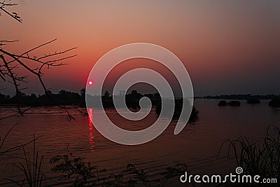 Sunset over the Mekong River near the island of Don Det in the Mekong Delta Stock Photo