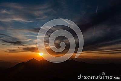 Silhouette of mountaintops during sunset Stock Photo