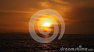 Sunset over the ocean with thunder clouds near Corinth, Greece. Stock Photo