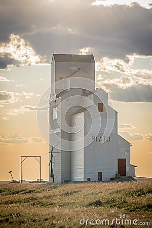 Sunset over a grain elevator in Plato, Saskatchewan, Canada Editorial Stock Photo
