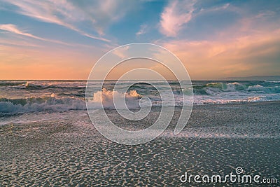 Sunset over the Pacific ocean. Beautiful dreamlike seascape, cloudy sky on background Stock Photo