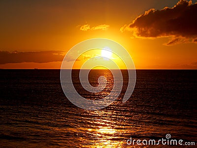 Sunset over the Pacific ocean waters Stock Photo