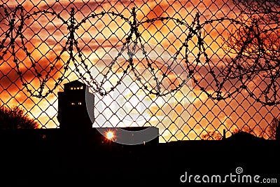 Sunset over prison yard Stock Photo