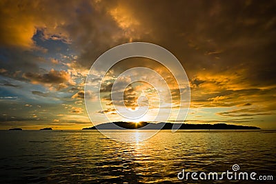 Sunset over rippled water Stock Photo