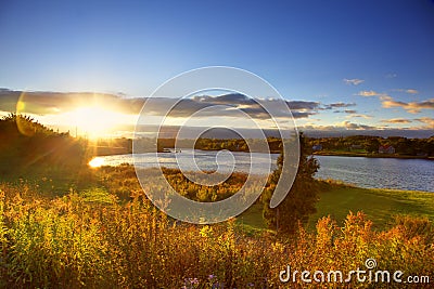 Sunset over river in autumn Stock Photo