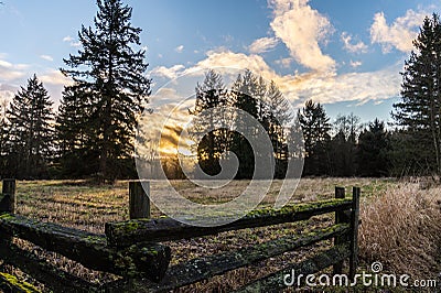 Sunset over Rural Farm Land Stock Photo