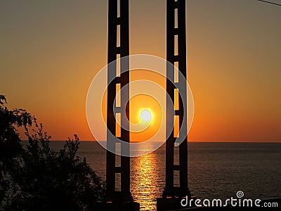 Sunset over the sea. Pillars. Stock Photo