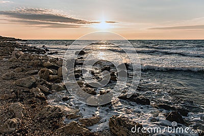 Sunset over the sea in warm colours Stock Photo