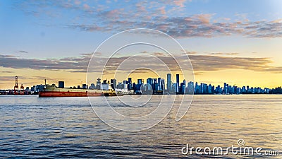 Sunset over the Skyline with High Rise Buildings and the Canada Place Cruise Terminal in Downtown Vancouver Editorial Stock Photo