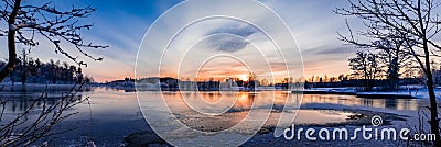 Sunset over a snowy and cold varmland, Sweden Stock Photo