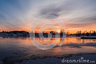 Sunset over a snowy and cold varmland, Sweden Stock Photo