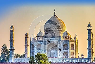 Sunset over Taj Mahal palace with flying ravens - Agra, Uttar Pradesh, India Editorial Stock Photo