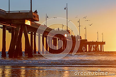 Sunset over Venice Beach Pier in Los Angeles, California - Birds Stock Photo