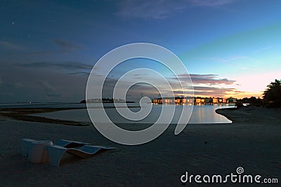 Sunset over water villas Stock Photo