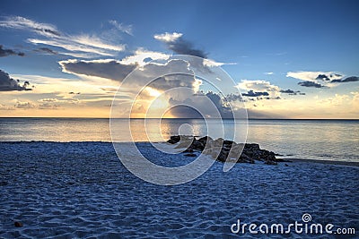 Sunset over the white sand on Naples Beach in Naples, Florida Stock Photo