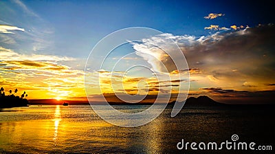 Sunset panorama with Tavurvur volcano at Rabaul, New Britain island, Papua New Guinea Stock Photo