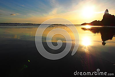 Sunset at piha beach, new zealand Stock Photo