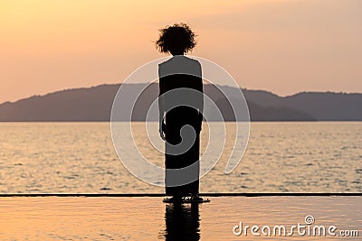 Sunset point with modern scary old woman silhouette sculpture in Ao Nang, Krabi, Thailand Editorial Stock Photo
