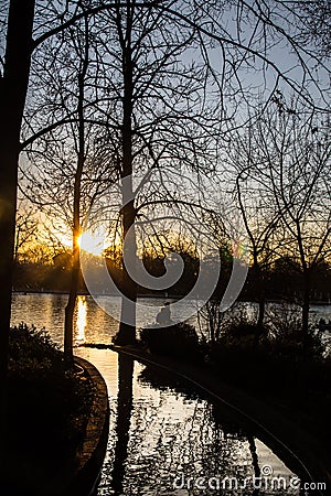 Sunset on the pond in the retirement park, madrid Editorial Stock Photo