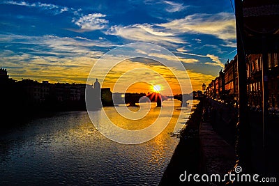 Sunset in Ponte alla Carraia alla Carraia Bridge through Arno Stock Photo