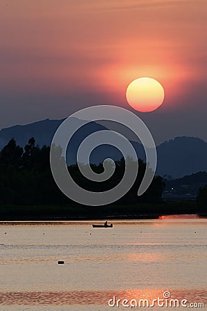 Sunset with sea and boat Stock Photo