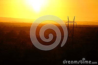 Sunset and Powerlines for Power and Communications Stock Photo