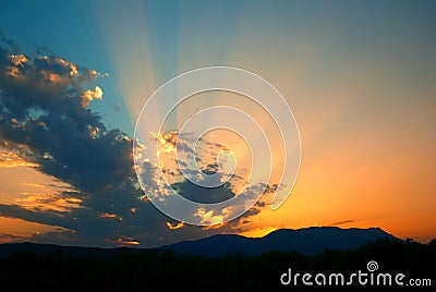 Sunset Rays and Clouds Stock Photo