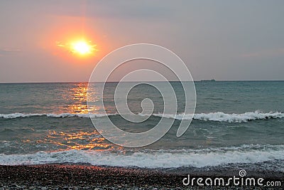 Sunset red light above the sea, ship silhouette Stock Photo