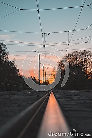 Sunset in reflection of a tram rail Stock Photo