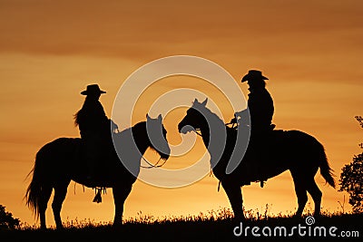 Sunset Riders Stock Photo