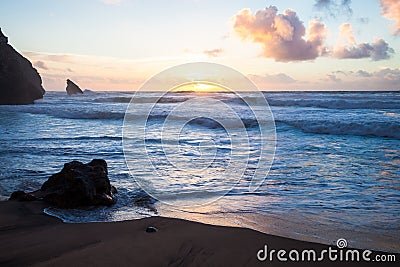 Sunset at rocky coastline of Adraga beach Stock Photo