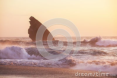 Sunset at rocky coastline of Adraga beach Stock Photo