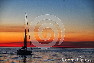 Sunset sailboat Stock Photo