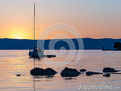 Sunset with sailing boat in Cres Editorial Stock Photo