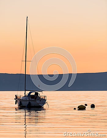 Sunset with sailing boat in Cres Editorial Stock Photo