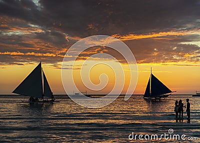 sunset with sailing boats and tourists in boracay island philippines Editorial Stock Photo