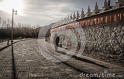 Sunset at the Samye Monastery with Pilgrim, Tibet Stock Photo