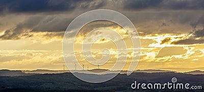 sunset in Sankt Wendel with wind power plants Stock Photo