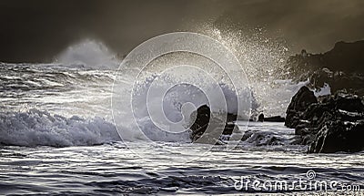 Sunset scene on rocky beach of South Wales coast,Uk Stock Photo