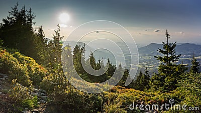 Sunset scenery on Smrk mountain in Moravskoslezske Beskydy in Czech republic with clear sky and only few clouds during late summer Stock Photo