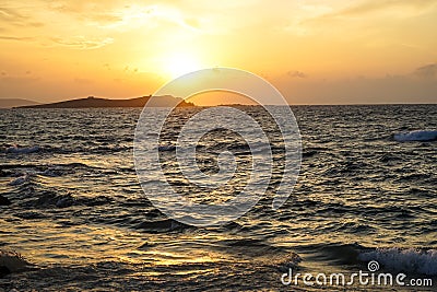 Sunset scenic powerful windy moving sea wave view with light reflection and beautiful shades of wide orange color sky background Stock Photo