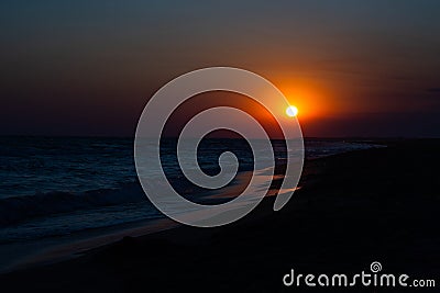 Beautiful sunset sun on the seashore Stock Photo