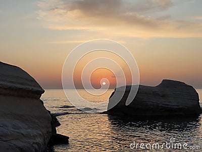 Sunset sea caves Cyprus Stock Photo